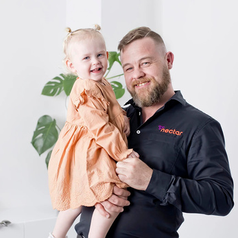 Daniel Doller holding his daughter