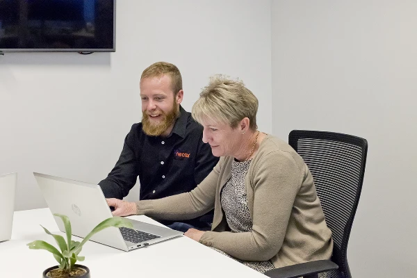 Creating-the-best-technology-solution-to-suit-your-needs Nectar Group employee working with client